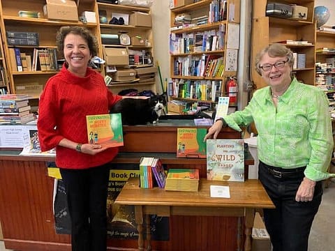 Authors appear together at book store.